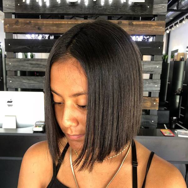Model Straight Bob Hairstyles- a woman wearing a black camisole