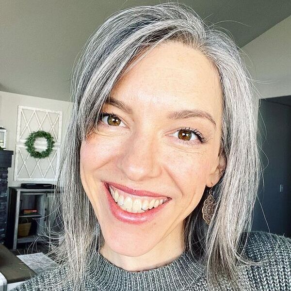 More Salt Than Pepper- a woman with gray hair wearing a dark gray sweater dress