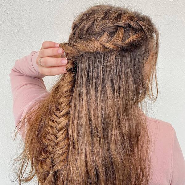 Multi Braids Half Up Half Down Hairstyles for Long Hair- a woman wearing a pastel pink sweater