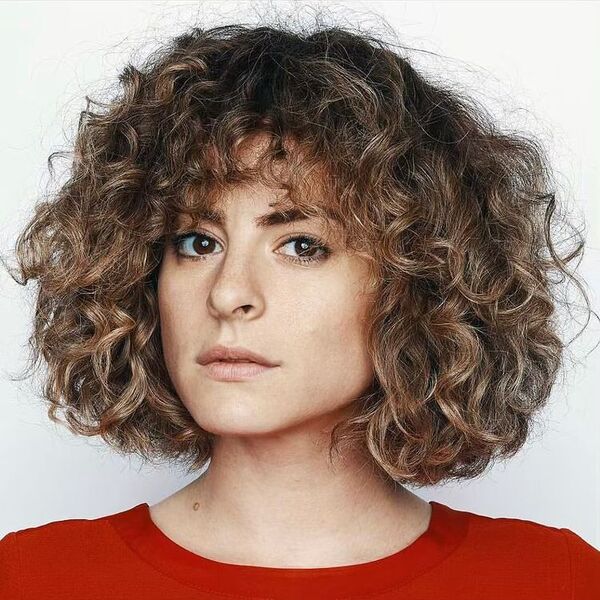 Natural Curly Bob Hairstyles- a woman wearing a red shirt