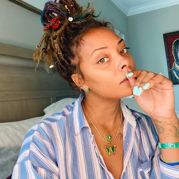 Natural Hair Colors- Eva Marcille wearing a stripe woman long sleeve