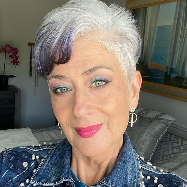 Natural Short Hairstyles for Women Over 60- a woman over 60 wearing a denim jacket