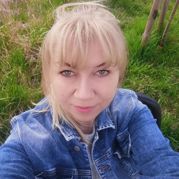 Naturally Blonde- a woman wearing a denim jacket