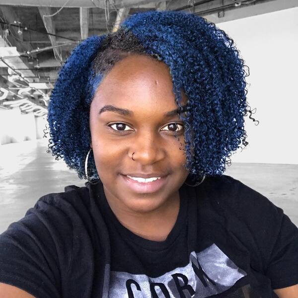 Navy Blue Hair Color- a woman wearing a black t-shirt