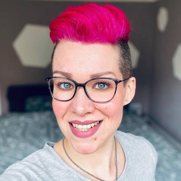 Neon Pink Short Hairstyle for Women- a woman wearing a gray t-shirt