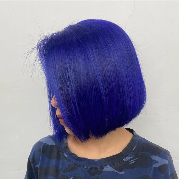 Neon Purple-Blue Hairstyle- a woman wearing a t-shirt