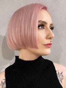 Pastel Pink for Chin-length Hair- a woman wearing a black off-shoulder blouse