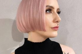 Pastel Pink for Chin-length Hair- a woman wearing a black off-shoulder blouse