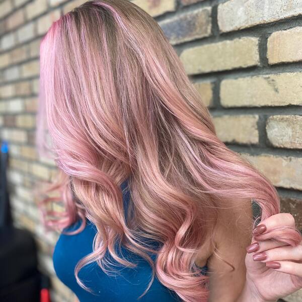 Pink Ashy Curls Hairstyles- a woman wearing a blue dress