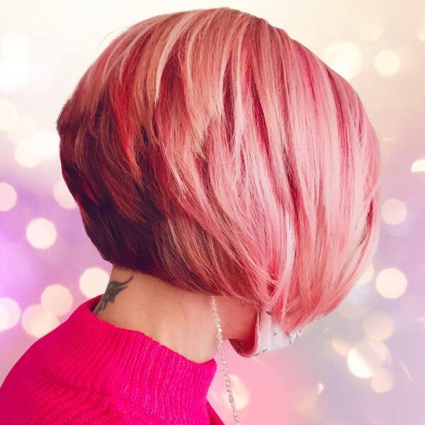 Pink Gradient Layered Bob Hairstyles- a woman wearing a pink turtle neck sweater