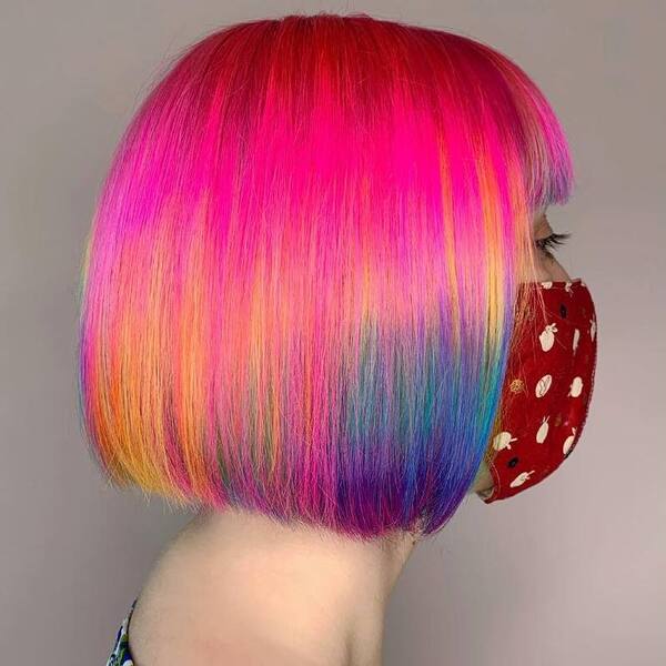 Pink Rainbow Kaleidoscope- a woman wearing a red face mask