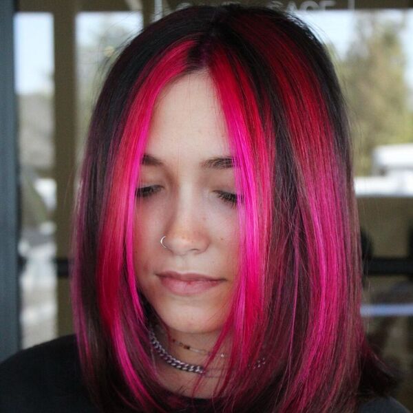 Pink Streaks, 2000's Throwback- a woman wearing a black t-shirt