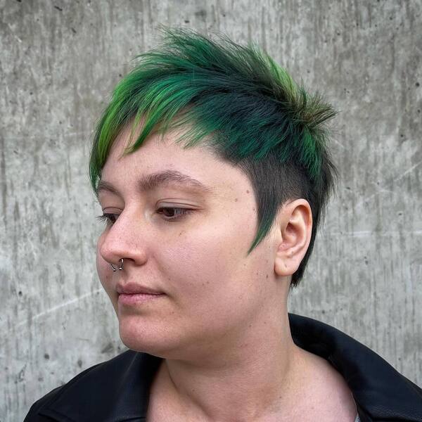 Pointy Green Edgy Hairstyles- a woman wearing a black jacket