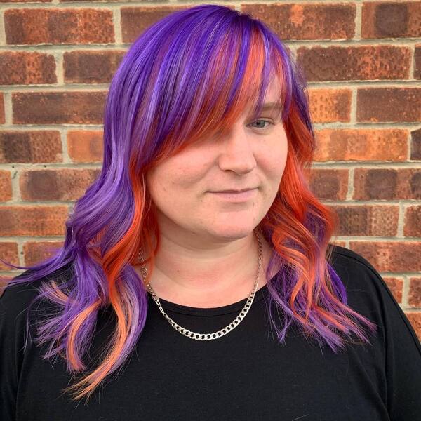 Purple and Orange Colorful Hair- a woman wearing a black t-shirt