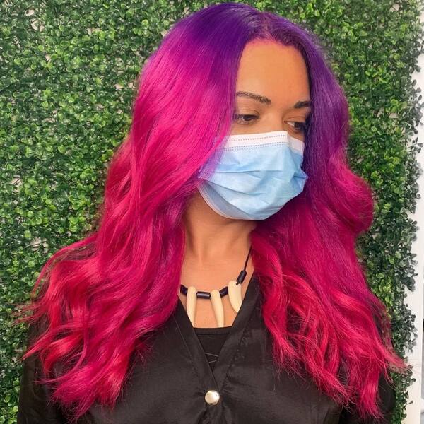 Purple to Pink Degrade- a woman wearing a face mask and a black dress