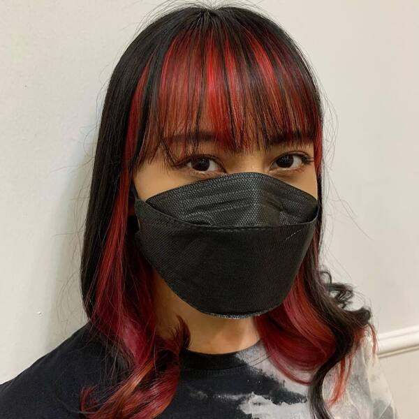 Red and Black Hair- an Asian woman wearing a black face
