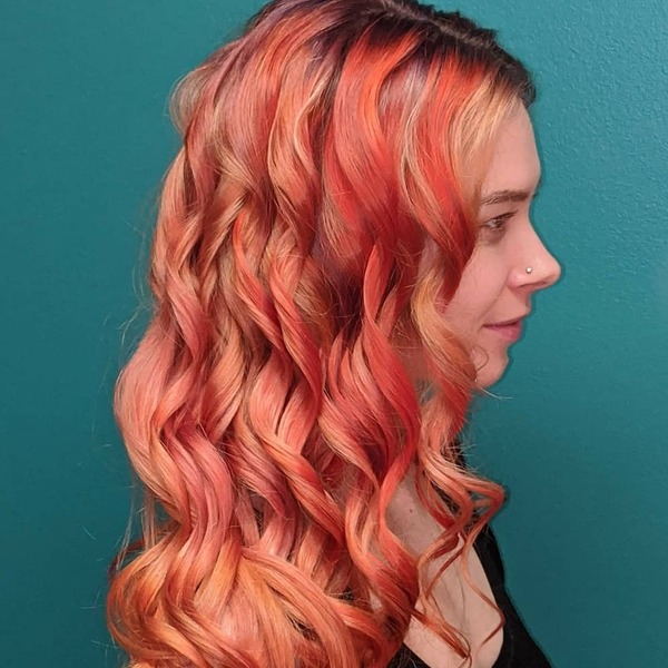 Rose-Gold Fall Phoenix Hair Colors- a woman wearing a black camisole