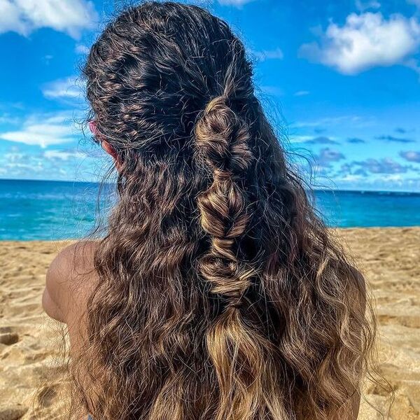 Seaside Hairstyles- a woman wearing a beach swim suit