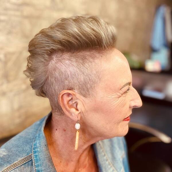 Shave It Off- a woman over 60 wearing a denim jacket