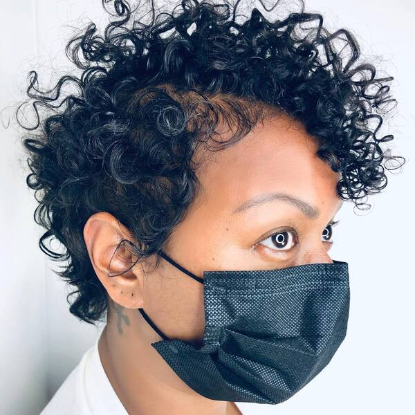Short Fine Curls Pixie- a woman wearing a black face mask