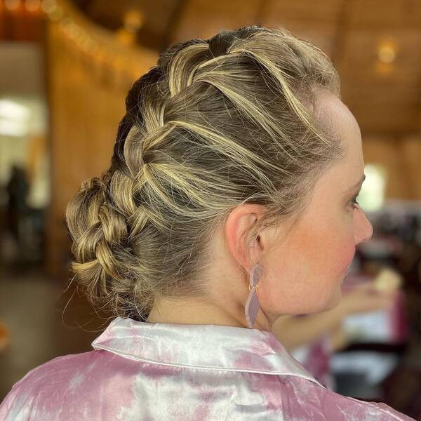Short French Braid Updo- a woman wearing a white with pink stained dress