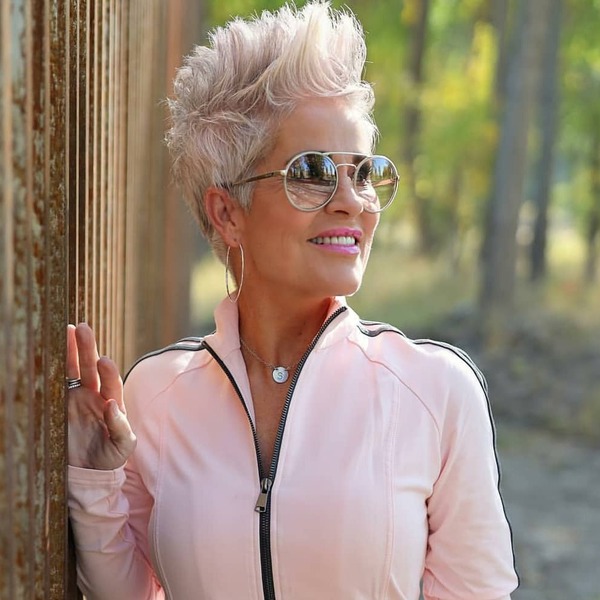 Short and Spiky Hairstyles for Women Over 60- a woman over 60 wearing a pink jacket