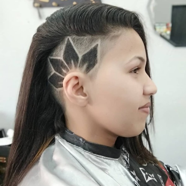 Side Razor Cut Design for Long Hair- a woman wearing a white barber's cape