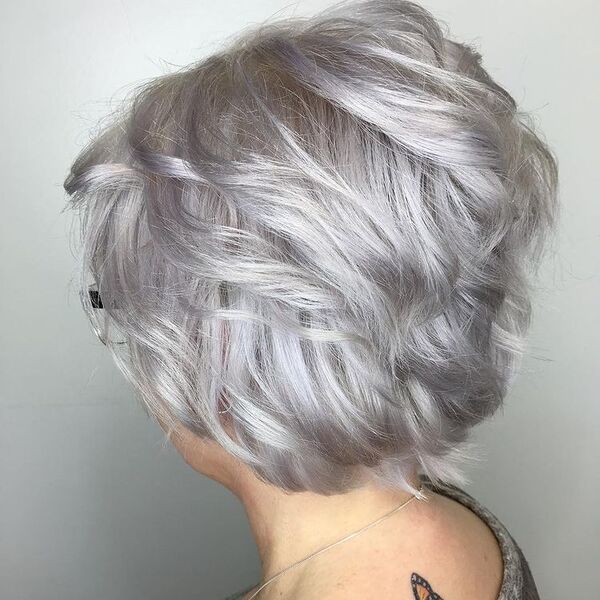 Silver Glam Hairstyle- a woman wearing a gray blouse