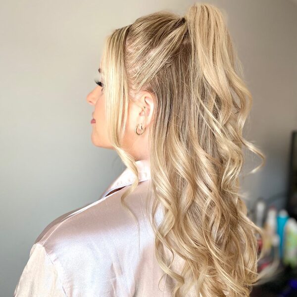 Simple Blonde Half Up Half Down Hairstyles for Long Hair- a woman wearing a silver blouse