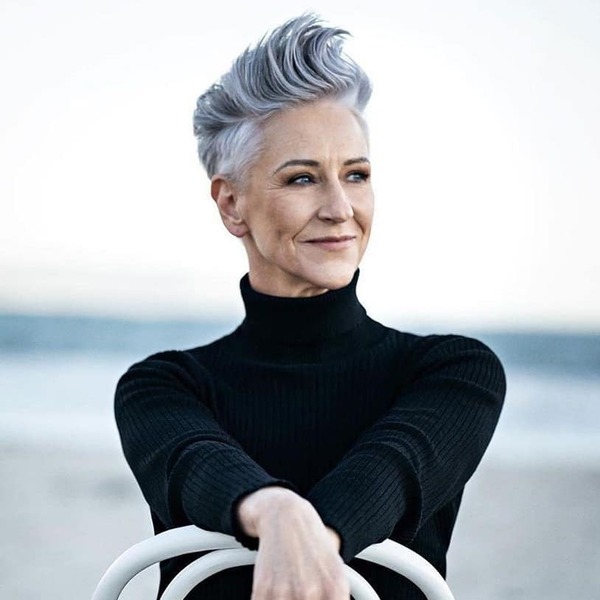 Spiky Hair for Gray Hair- a woman with gray hair wearing a black turtle neck sweater