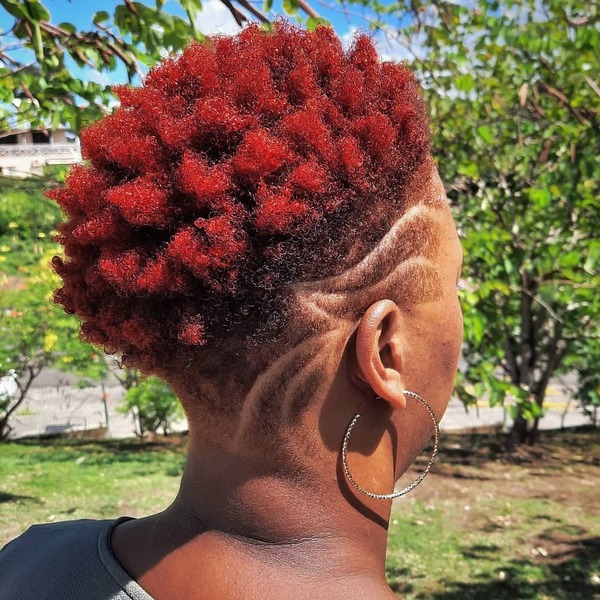Spiky Haircut for Black Women- a black woman wearing a big earrings