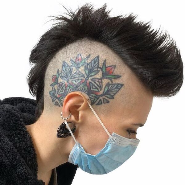 Tattoo Show- a woman wearing a face mask