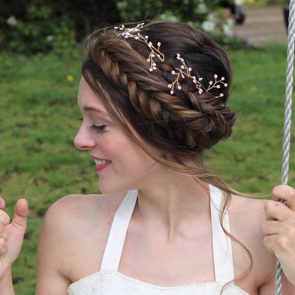 The Hair Crown Hairstyle for Thick Hair- a woman wearing a white wedding dress