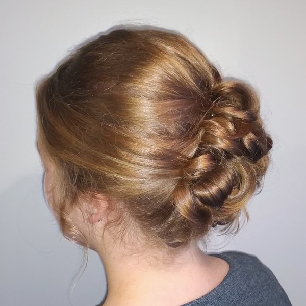 The Tuck Updo for Medium Hair- a woman wearing a gray t-shirt