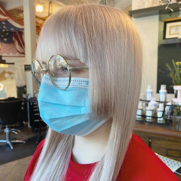 Three-layered Anime Inspired Hairstyles- a woman wearing an eye glass and a face mask