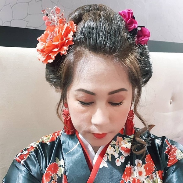 Traditional Vibe- a woman wearing a traditional Asian dress