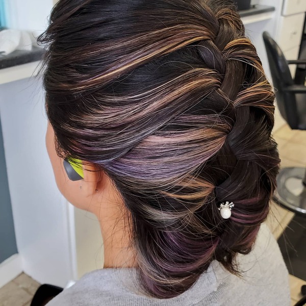 Tucked French Braid Styles- a woman wearing a gray shirt