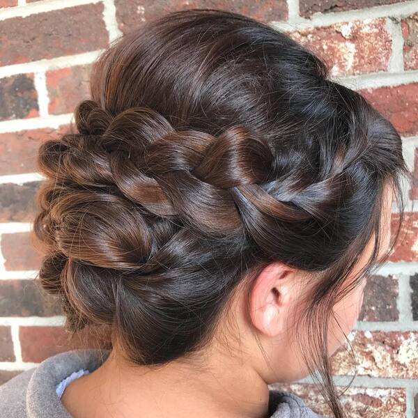 Twisted French Braid Updo- a woman wearing a gray jacket