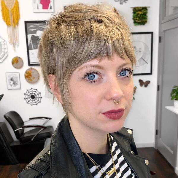 Very Short Shag Pixie Cut- a woman wearing a black leather jacket