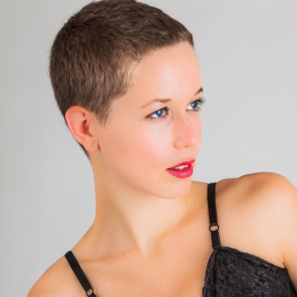 Vintage Shaved Hairstyle- a woman wearing a black camisole