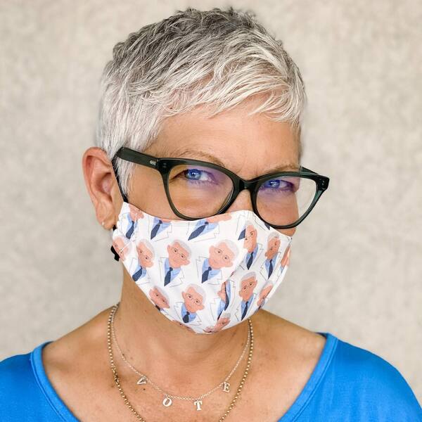 Youthful Pixie Haircut- a woman wearing a white face mask