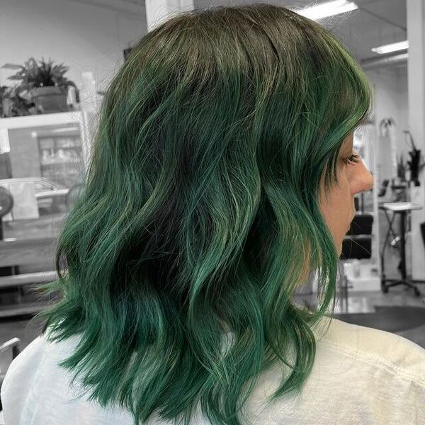 Forest Green Medium Hairstyles - a woman wearing a gray shirt in a back view