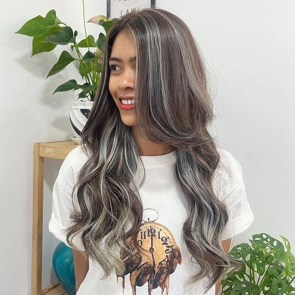 Gray Highlights with Layered Hairstyles for Long Hair - a woman wearing a white shirt