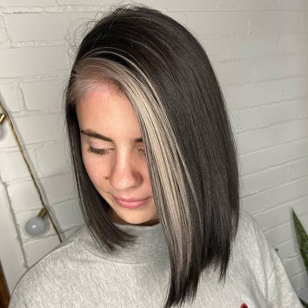 Incredible Natural White Streak Hair- a woman wearing a gray sweater