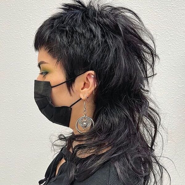 Mullet Peak - a woman wearing a black face mask