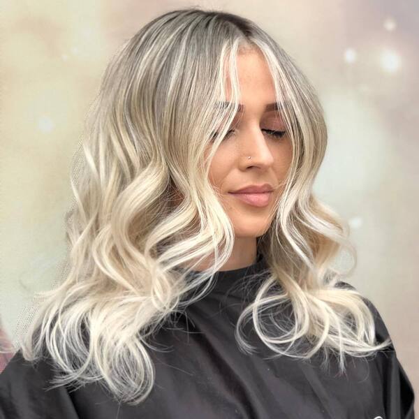 Ombre Hairstyles for Round Faces- a woman wearing a black barber's cape