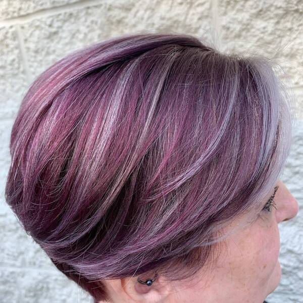 Purple Hair with Gray Highlights- a woman wearing an earrings